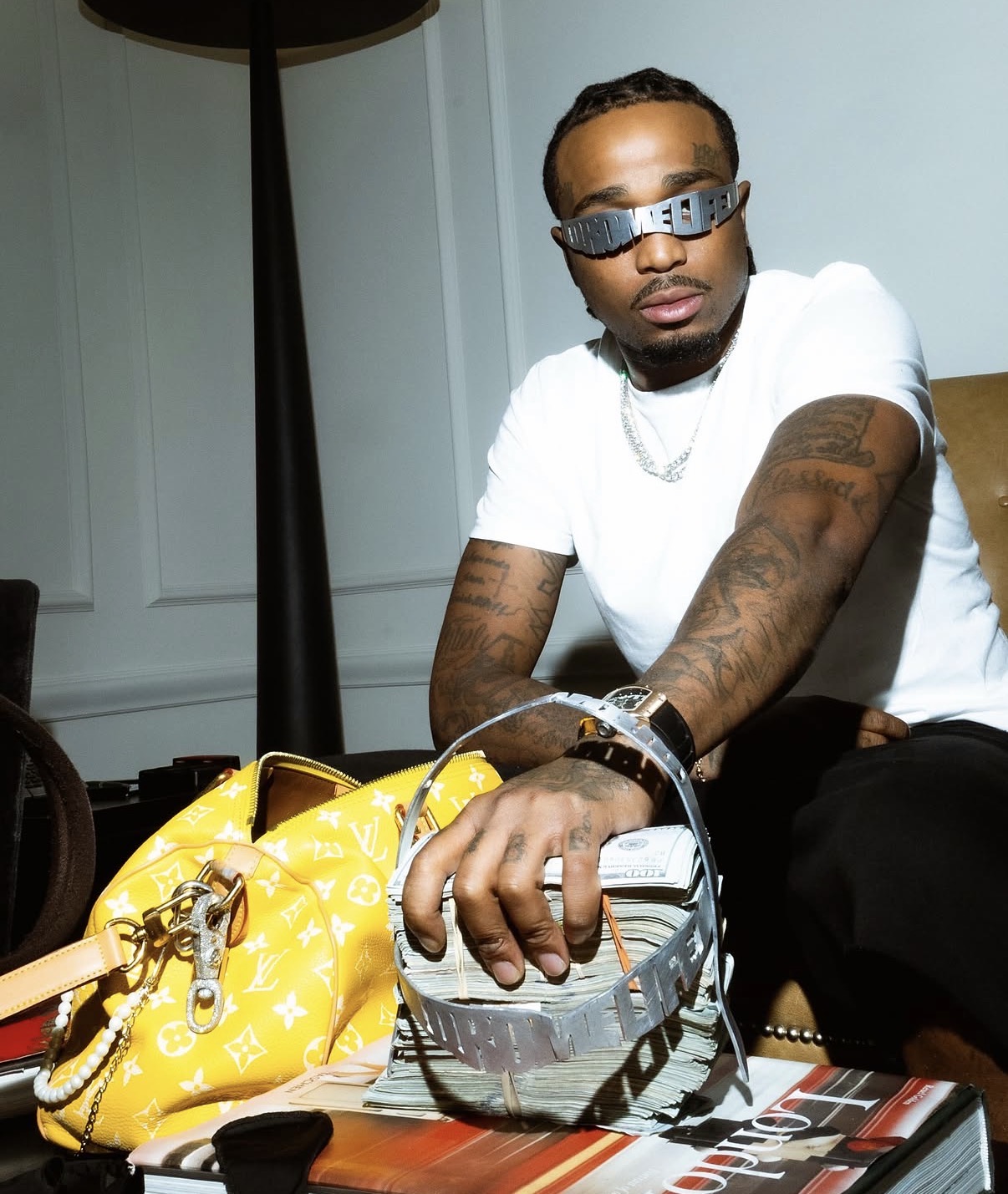 Quavo wearing the handmade polished aluminum QRÖMELIFE glasses